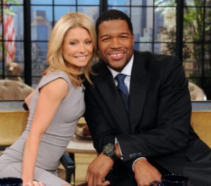 Kelly Ripa and Michael Strahan pose on the set of their show