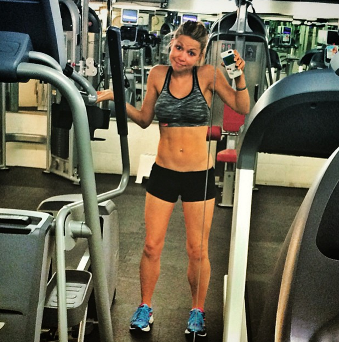 GiGi Dubois in the gym in a sports bra and shorts